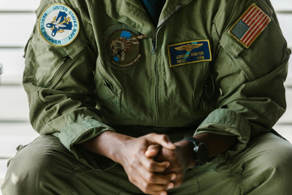 pexels-photo-7468208-7468208 Detail of a US military uniform showcasing patches indicating honor and bravery.